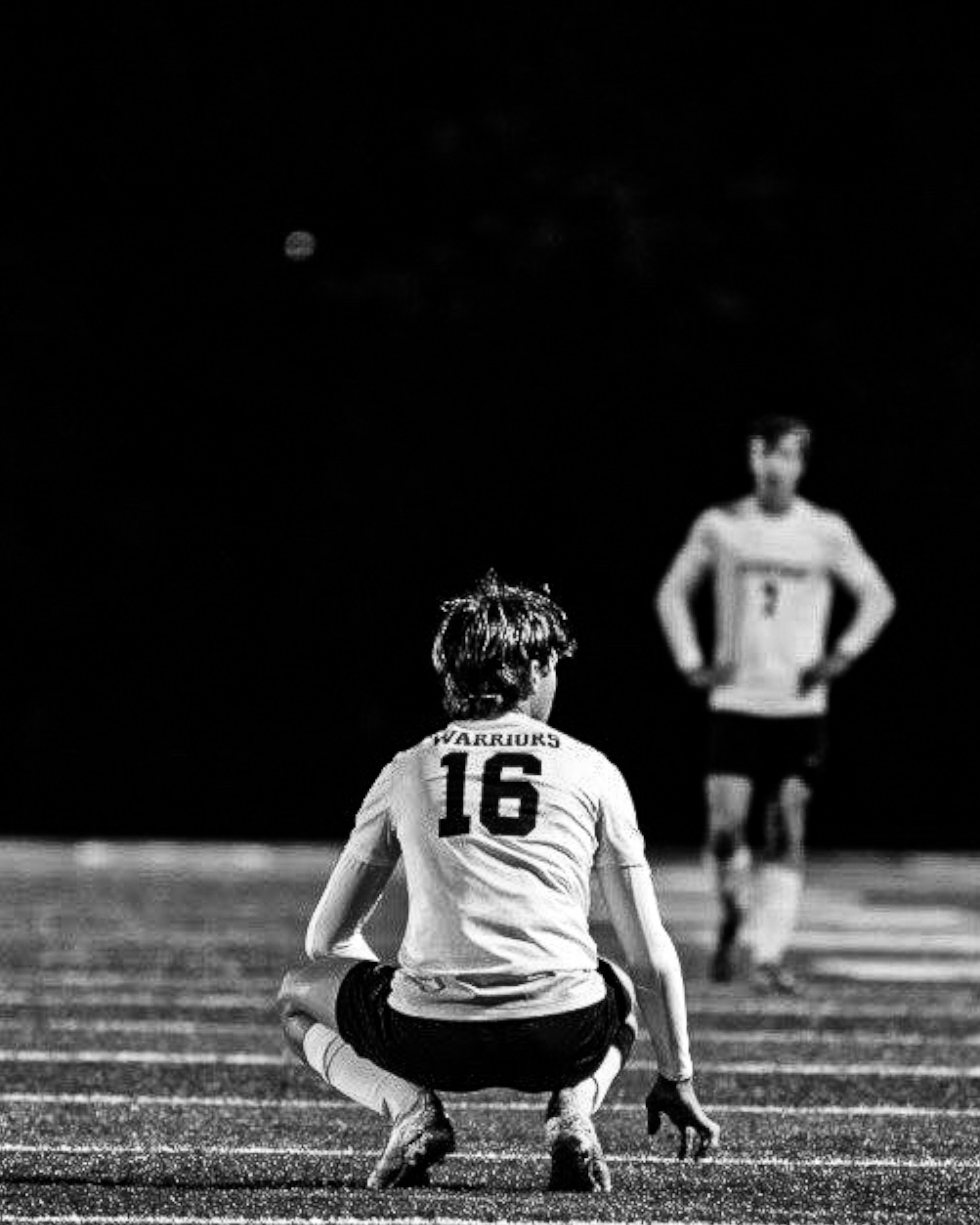 Black and white Warriors player #16